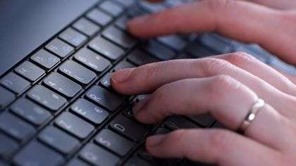 Typing on a keyboard.