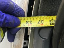 Measuring from the back of the trunk to the rear bumper on the left side of the TL Sport we get 37.75”