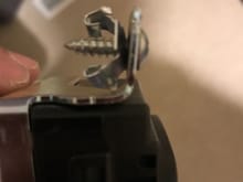 The screw and washer that gave me hell. Hopefully you guys can help me figure out this part regarding the screws washer at the end.