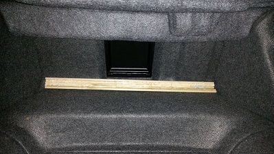 This is the rounded edge near the back seat.  A pain to shape with wood but easy with multiple dowels just pushed together.  I chose to glass the box due to the odd shape of the trunk and still wanted access to my spare tire and trunk space.