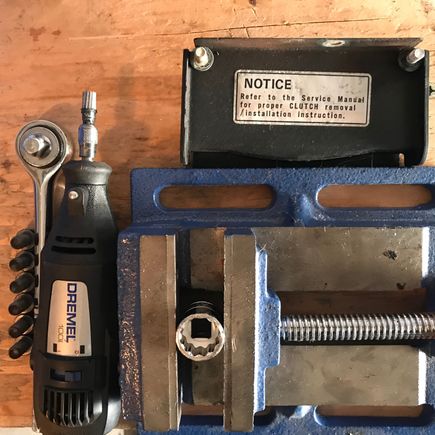 I used a Dremel to shave the socket tip so it would completely seat over the FW bolt.

The last thing we want are rounded FW bolts.