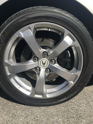 Stoptech slotted rotors, painted calipers black with acura decals.