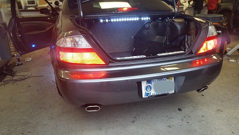 Amp location prior to reinstall of subwoofers and amplifiers. They are now located behind the seats accessible via the middle seat port to the trunk for adjustments