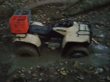 And this is the worst one. This was before I tried to get it out. By the time I had to pull it out with my buddy's truck, the front tires were completely covered. The pit was dry until I got on it and stirred up the water under it.