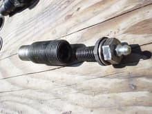 Left side bolt.  Tapped it out for a 7/16 bolt.  Made a 7/16 bolt greasable and threaded it in after drilling a small hole through the swingarm bolt.                                                   