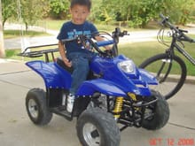 My boy on his ATV.  This chinese quad is one badass quad.  No major problems on it so far and he's loving the time on it.