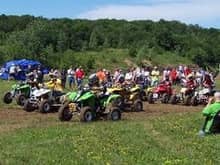 Women's holeshot at Bluff Creek June 13th, 2004. (I'm on a KFX400 in this race, but still #555 with yellow number plate) Pwrench on right taking pic!                                                   