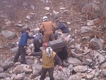 Jigga and his Grizzley clearing the rock climb at the bottom before the steep part with help from Troyboy, BG, Tuan.
