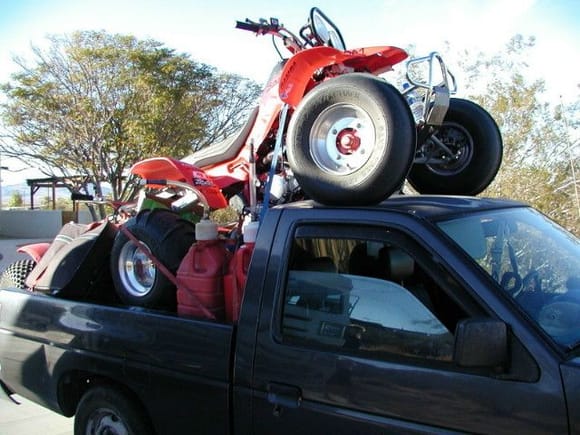 My old truck loaded with a weeks worth of food and drink, the quad, and a ATC185s behind it.                                                                                                            