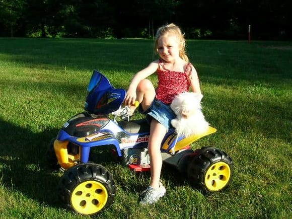 My daughter posing on her ATV