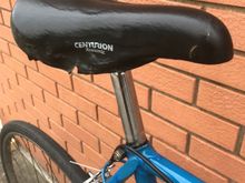 Glamour shot of my raggedy Centurion/Vetta saddle from a bike rescued from a scrapyard and the recycled shim.