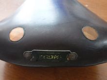 Badly worn plate, more so than saddle