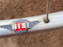 Not a sticker, but a badge that I would suspect could throw off the weight balance 
