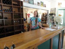 Jim's daughter in law and our barista for 27 years.   Some of the bottles behind the bar, and off to the left a room full of winemaking supplies for the home winemakers.