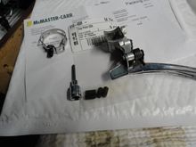 The band, body, and set screws, with the hex bit for installing the screw.  