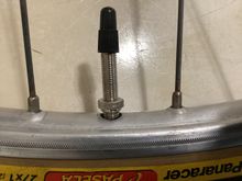 Unscrewed to show Schrader hole. 