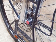 203mm Magura rotor on front and 180mm on rear. Smooth and powerful braking. Ever try descending Tioga Pass down to Mono Lake on a heavly loaded bike? Not one curve in that highway - straight DOWN.