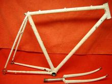 Frame as purchased.  Based on frame specifics and remnants of blue paint inside the bottom bracket, plus sellers description of original part compliment, it was determined this started life as a '84 SR Maxima that was repainted.  The rework streaking, dark brown in this case, was popular in the early 90's.  I had the frame stripped and powder coated 'Illusion Orange'.  I am a Suntour Fan-Boy and I find it hard to turn away any vintage Japanese frame that uses the high-end Superbe Pro dropouts!