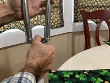 I am a lefty, so you may want to switch hands. This is what I mean by hold it vertically. The lower hand’s job is to keep everything snug. The upper hand grips the fork legs and is the hand that you apply downward force with. 