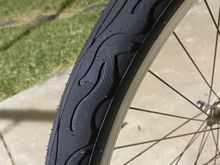 Odd tread pattern - swirls, flames, or a sinister plot to hypnotize the rider?