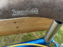Saddle by Selle Italia, I can’t make out what it says. 