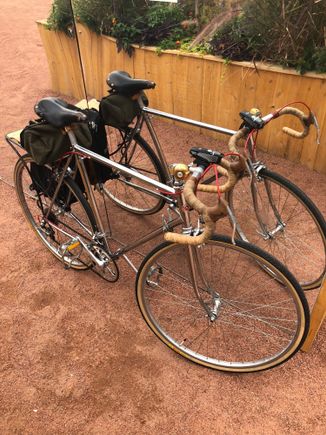Chrome Schwinn Voyageur leaning on a mirror.