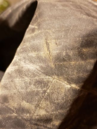 Separation in the casing threads at the tear.