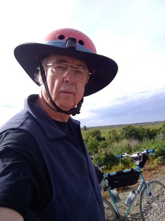 Nutcase helmet with "Da Brim" sun screen brim to try and keep the skin cancer from returning.