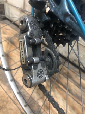 Looks like Peugeot labeled SLJ.  I like this derailleur so I hope it’s still good.