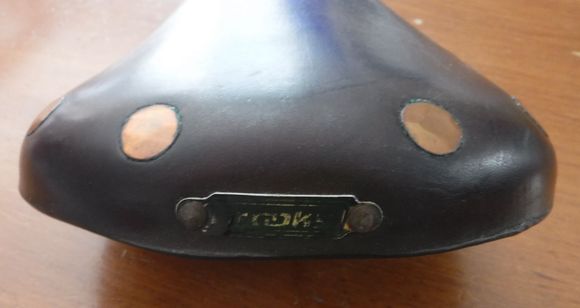 Badly worn plate, more so than saddle