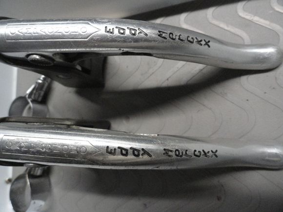 There are a few scuffs in the levers but are not deep and show some wear of road duty as would be suspected in an older set of levers.  