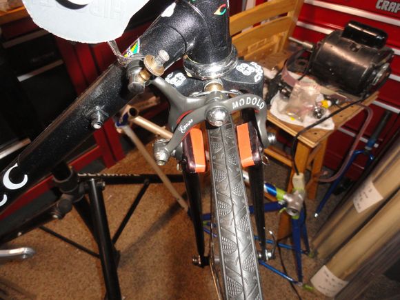 My choice of dark anodized Modolos with new salmon pads from KS.  I had to find a spacer and change the anchoring nut for the recessed brake feature.