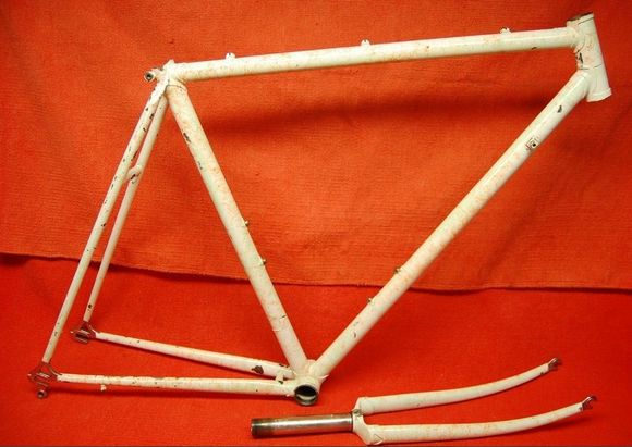 Frame as purchased.  Based on frame specifics and remnants of blue paint inside the bottom bracket, plus sellers description of original part compliment, it was determined this started life as a '84 SR Maxima that was repainted.  The rework streaking, dark brown in this case, was popular in the early 90's.  I had the frame stripped and powder coated 'Illusion Orange'.  I am a Suntour Fan-Boy and I find it hard to turn away any vintage Japanese frame that uses the high-end Superbe Pro dropouts!