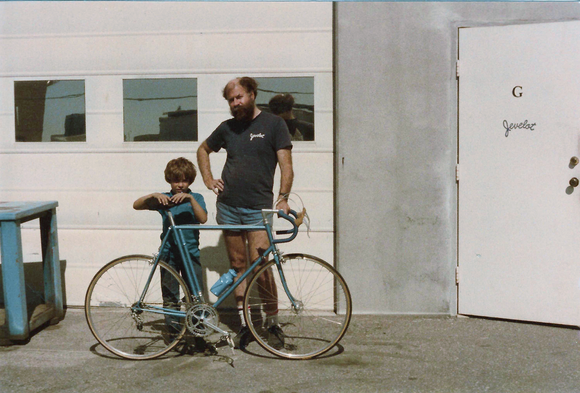 Hugh with his son and one of his bikes, in front of his Jevelot shop
