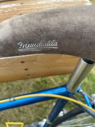 Saddle by Selle Italia, I can’t make out what it says. 