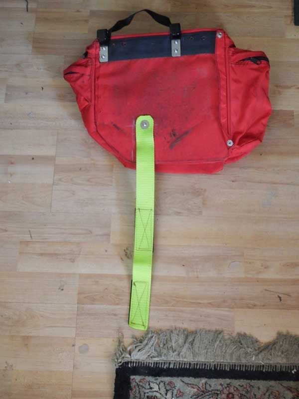 The clips and strap are attached using M4 stainless screws. The clips are from Jandd (pannier hardware).