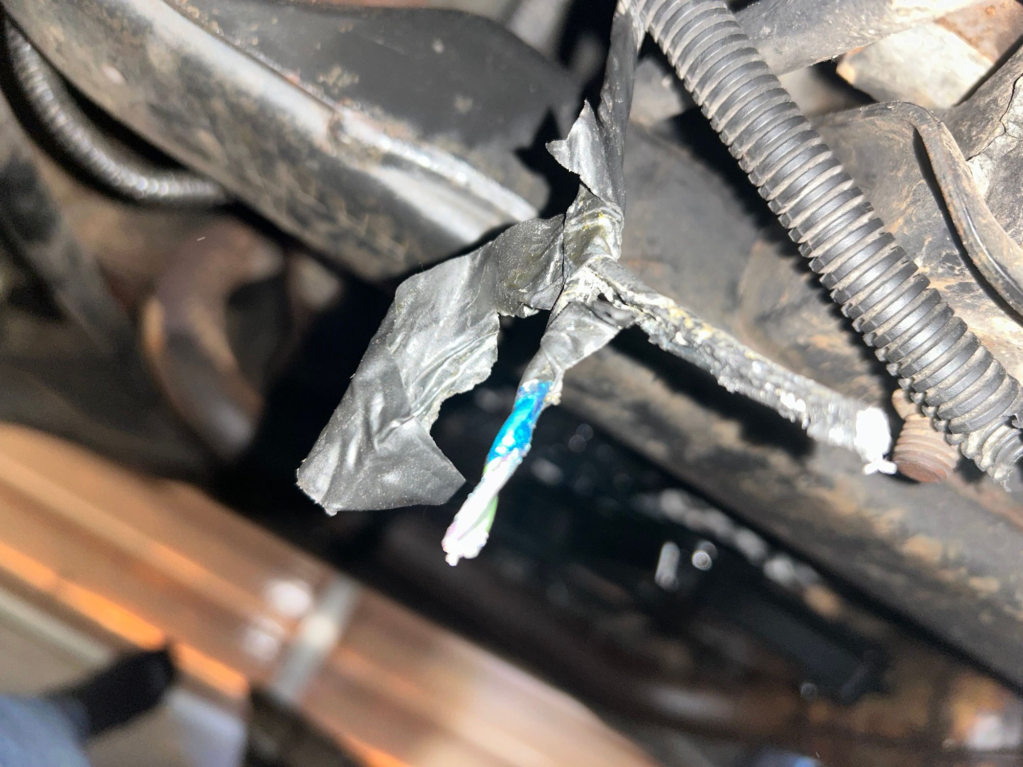 Possible transfer case wiring or something leading towards the rear of the vehicle