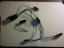 Wiring harness. White lead connects to RAP. The bottom two connectors go between the plug to the power outlet and the power outlet.