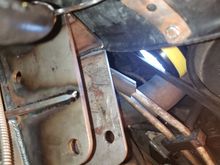 Another view of the fan shroud, its cutout and the idler arm bracket.