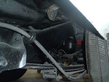driver's side bracket to the wheel.  (Bracket is outside of the frame rail)