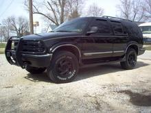 spring clean up. I painted the stock rims with semi-gloss rustoleum spray paint, and I also painted the grill also. I also added coil overload shocks on the rear to level it out.