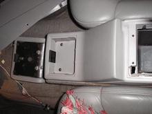 Console cup holder attaches with 3 metal clips