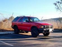 Most recent picture after painting the rims and grille. Plus new headlights. Also, had to replace the inner/outer tie rods after the lift.