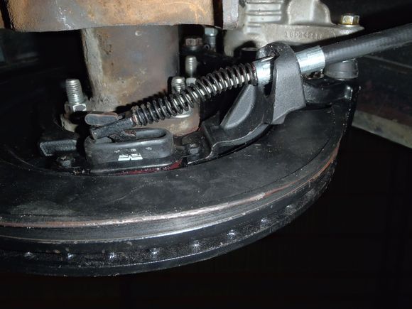 Rear brake cable attached to rear disc.
