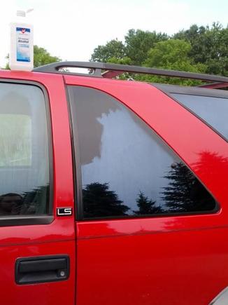 Cleaning this...stuff off all the windows.  I think it was some sort of spray on tint, but it really discolored things.