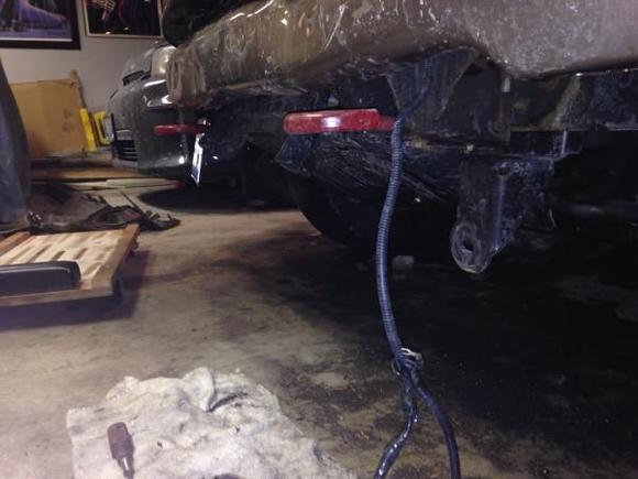 image, close up of under smashed bumper.