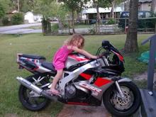 My step daughter on my bike, well she thinks its hers but she does let me ride it