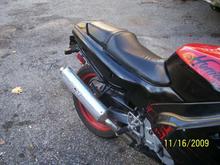 Front right corner, you can just make out some red on the fron fairing its where the stripe should be, previous owner just painted over it =/ grrrr

scraped a lil paint off to show its under there