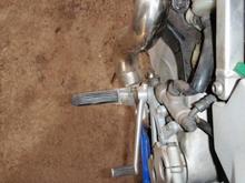 Footpeg mod, original alloy bracket broke off. So I made a new one. This one moves the peg out 2cm, and saves my boot from melting.
