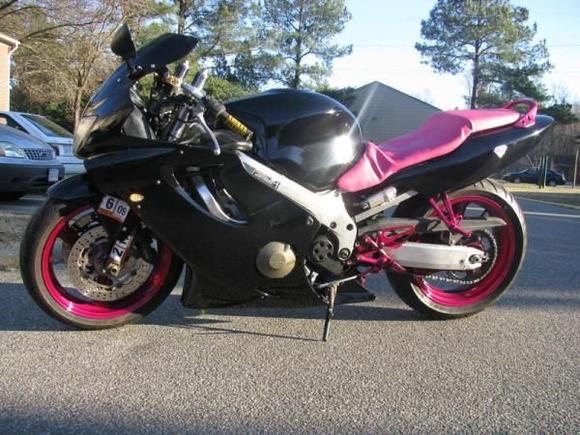 This is how it looks now. Powdercoated the wheels, front and rear foot pegs, repainted the farings. My wife rewraped the seat. More Pics coming as soon as we get the rest of the stickers, which will be pink chrome.
